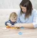 Little boy and his mom play in developing the game Royalty Free Stock Photo