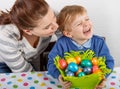 Little boy and his mother being happy about selfmade Easter eggs Royalty Free Stock Photo