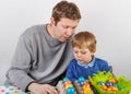 Little boy and his mother being happy about selfmade Easter eggs Royalty Free Stock Photo