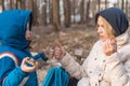 A little boy with his mother eat in the forest. The interaction of mother and child Royalty Free Stock Photo