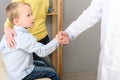 Little boy with his mother at paediatrician on consultation Royalty Free Stock Photo