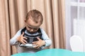 Little boy in his nursery in virtual world gadgets game home. space for text Royalty Free Stock Photo