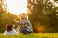 Little Boy With His Pet Dog Outdoors