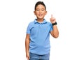 Little boy hispanic kid wearing casual clothes showing and pointing up with finger number one while smiling confident and happy Royalty Free Stock Photo