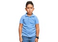 Little boy hispanic kid wearing casual clothes skeptic and nervous, frowning upset because of problem Royalty Free Stock Photo