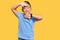 Little boy hispanic kid wearing casual clothes smiling cheerful playing peek a boo with hands showing face Royalty Free Stock Photo