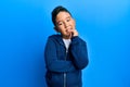 Little boy hispanic kid wearing casual sporty jacket smiling looking confident at the camera with crossed arms and hand on chin Royalty Free Stock Photo