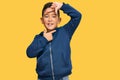 Little boy hispanic kid wearing casual sporty jacket smiling making frame with hands and fingers with happy face Royalty Free Stock Photo