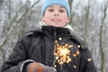 Little boy hold sparkler in forest Royalty Free Stock Photo