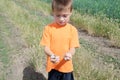 Little boy holding butterflies in hands