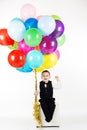 Little boy holding colorful balloons Royalty Free Stock Photo