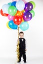 Little boy holding colorful balloons Royalty Free Stock Photo