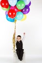 Little boy holding colorful balloons Royalty Free Stock Photo