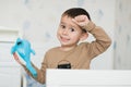 Little boy holding a dolphin toy in his playroom Royalty Free Stock Photo