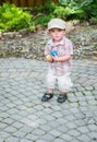 Little Boy Holding Handfuls of Colorful Easter Eggs Royalty Free Stock Photo