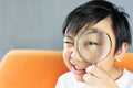 Little boy holding Magnifying glass Royalty Free Stock Photo