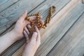 Little boy holding old wooden rosary. Royalty Free Stock Photo