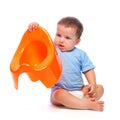 Little boy holding potty Royalty Free Stock Photo