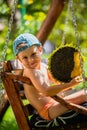 Little boy holding ripe sunflower head