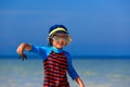 Little boy holding starfish at summer beach Royalty Free Stock Photo