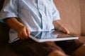 Little boy holding a tablet on his lap Royalty Free Stock Photo