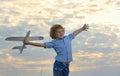 little boy holding a wooden airplane model Royalty Free Stock Photo