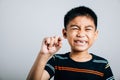 Happy child holds a fallen baby tooth showcasing dental care. First lost Royalty Free Stock Photo