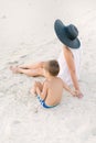 Little boy holds the hand of his mother. Beach holiday