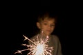 A little boy holds a lit Sparkler Royalty Free Stock Photo