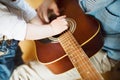 Little boy at home playing guitar with his father. Royalty Free Stock Photo