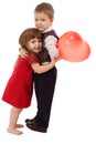 Little boy hugging girl with red balloon Royalty Free Stock Photo