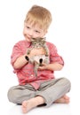 Little boy hugging a kitten. isolated on white bac