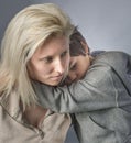 Little boy hugs his mother