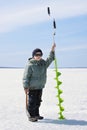 Little boy with ice drill Royalty Free Stock Photo