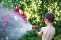 Little boy irrigate in garden Royalty Free Stock Photo