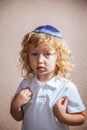 The little boy with in Jewish knitted kippah