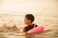 Little boy jumping over the beach wave Royalty Free Stock Photo