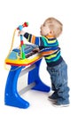 Little boy and the keyboard on white background. funny boy baby. Royalty Free Stock Photo