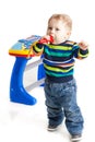 Little boy and the keyboard on white background. Royalty Free Stock Photo