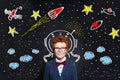 Little boy kid astronaut on blackboard background with space scetch Royalty Free Stock Photo