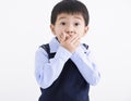 Little boy kid shocked and hand covering mouth for mistake Royalty Free Stock Photo