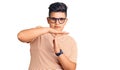 Little boy kid wearing casual clothes and glasses doing time out gesture with hands, frustrated and serious face Royalty Free Stock Photo