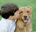 Little Boy Kissing Dog