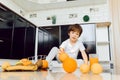 Little boy in the kitchen with a bowl of fresh fruits Royalty Free Stock Photo