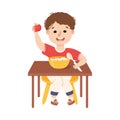 Little Boy at Kitchen Table Eating Porridge for Breakfast Engaged in Daily Activity and Everyday Routine Vector