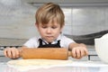 Little boy kneads dough in his hands Royalty Free Stock Photo