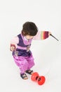 Little boy in korean silk suit plays with diabolo Royalty Free Stock Photo