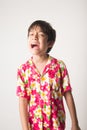 Little boy laughing portrait standing angry face Royalty Free Stock Photo