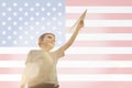 Little boy launches a paper plane into the air on the flag of america background. Child launches a paper plane with pride Royalty Free Stock Photo