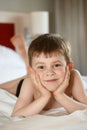 Little boy laying on bed Royalty Free Stock Photo